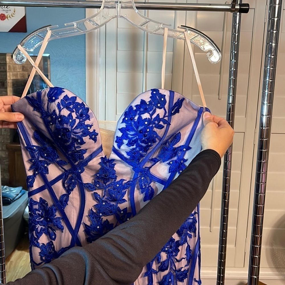 Blue floral design with rhinestones. Great condition. Only worn once.